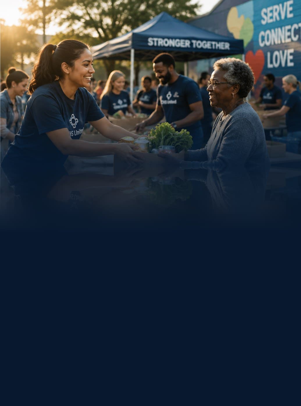 Community Volunteers handing out groceries at a neighborhood food drive